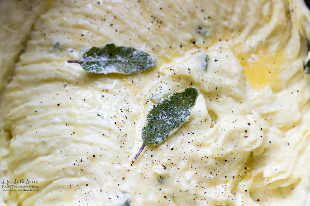 Perfect Sage Thyme Butter Whipped Potatoes up close with sage leaves