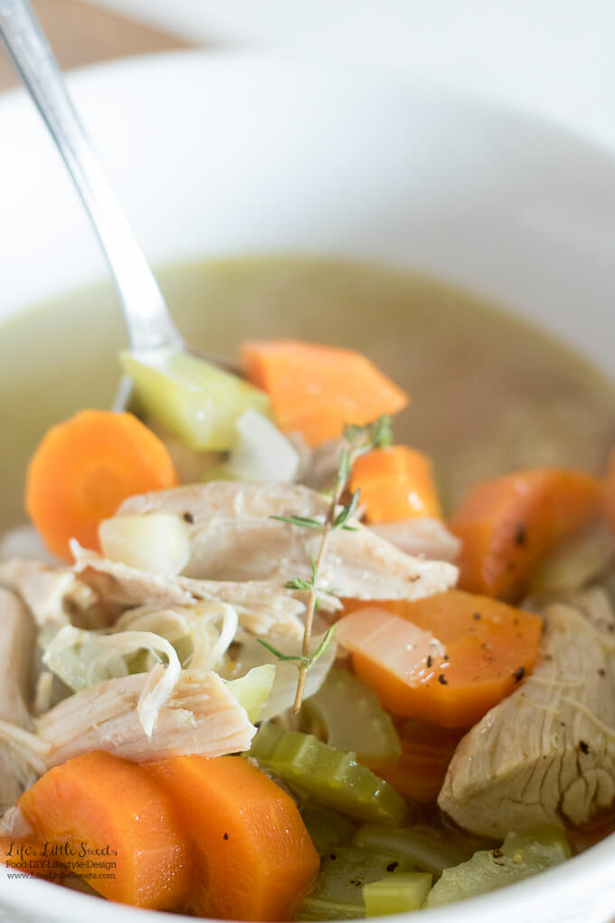 This nourishing Homemade Turkey Soup recipe can be made with leftovers from a Turkey dinner. You can make the broth from turkey leftovers, just add some veggies and turkey meat and you are all set for a delicious and savory soup! #thanksgivingleftovers #bonebroth #celery #carrots #soup #turkey #turkeymeat #broth