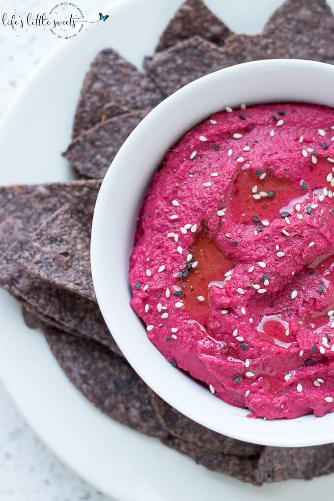 Roasted Beet Hummus Recipe on SoFabFood - This easy Roasted Beet Hummus recipe has seasonal, freshly roasted beets, warm cumin, tahini, and chickpeas. Enjoy this appetizer with your favorite chips or pita bread and don’t forget to share! #beets #hummus #snacks #beetroot #oliveoil #appetizers