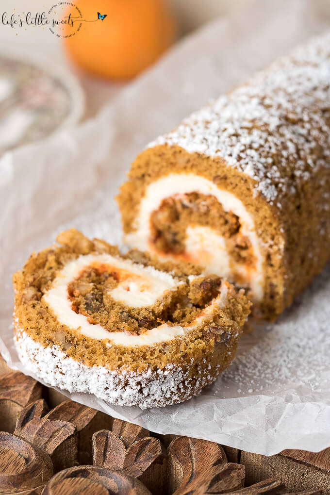 This Pumpkin Roll Recipe is the perfect recipe to feature on the Thanksgiving or Christmas dessert table! This Pumpkin Roll is a thin, moist pumpkin cake with or without walnuts, filled with a creamy frosting mixture and wrapped into a swirl of sweet heaven! (makes 1 roll, 10 slices) #pumpkinroll #pumpkin #dessert #pumpkinspice #pumpkinrollrecipe #creamcheese #cake