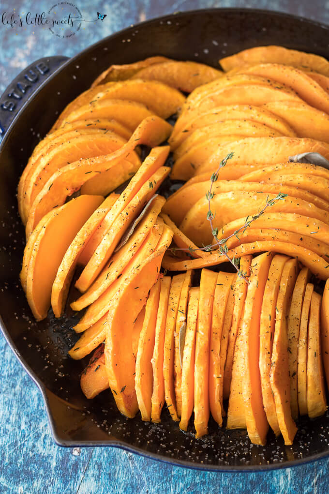 This Skillet Oven Roasted Butternut Squash is sliced thin, seasoned with herbs like thyme and sage and then baked in the oven. Enjoy this easy, tasty and beautiful way to enjoy butternut squash! (vegan, gluten-free) #butternutsquash #baked #roasted #sage #thyme #vegan #glutenfree #sliced