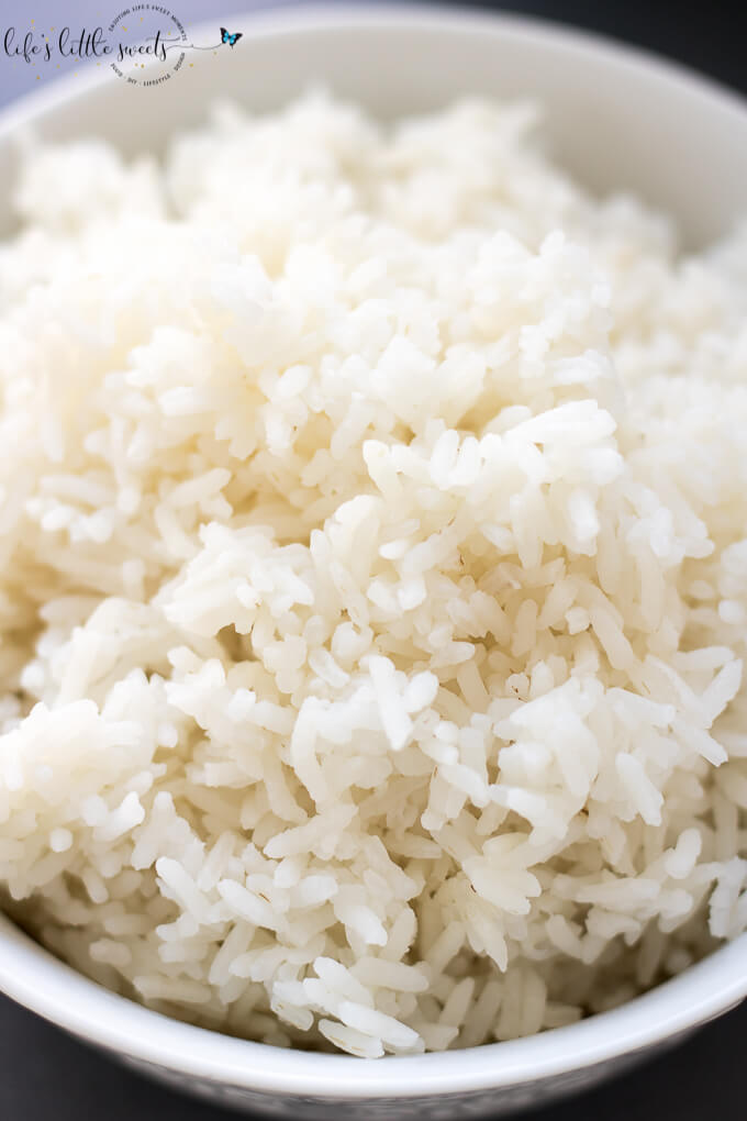 White rice in a ceramic white bowl close up