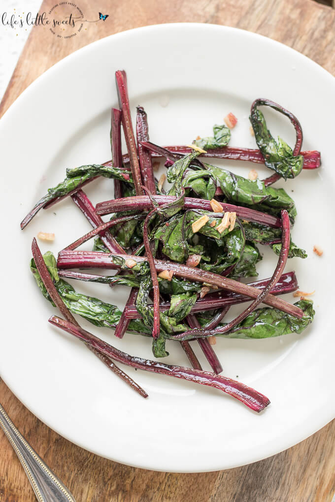 Sautéed Beet Greens are a colorful, savory and delicious addition to any meal. These greens are cooked with olive oil, garlic, salt and pepper. (1-2 servings, vegan, gluten-free) #beets #beetgreens #greens #garlic #oliveoil #Sautéed