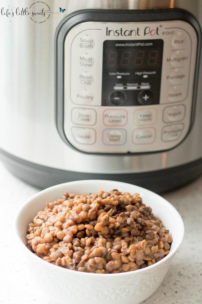 cooked lentils in a white bowl with an instant pot