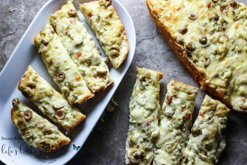 Green olives (which are my favorite), two kinds of cheese, butter, green chiles… and, oh yes, jalapeños. #greenchiles #bread #appetizer #cheese #butter #jalapeños