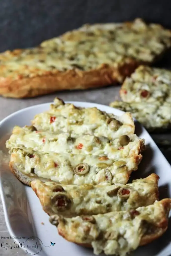 Green olives (which are my favorite), two kinds of cheese, butter, green chiles… and, oh yes, jalapeños. #greenchiles #bread #appetizer #cheese #butter #jalapeños