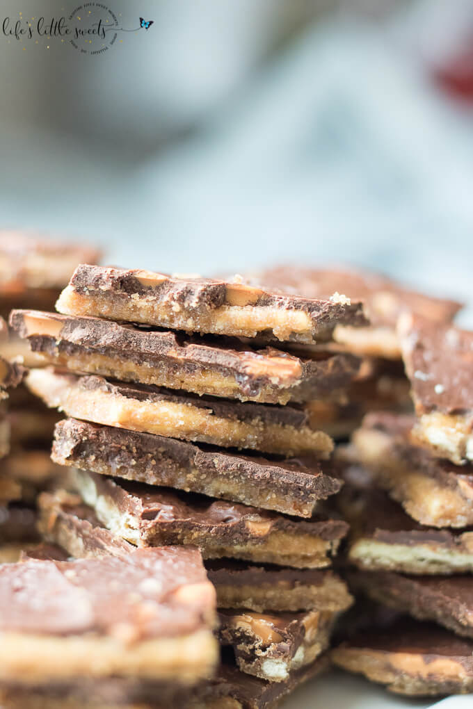 Chocolate Butterscotch Saltine Toffee combines semi sweet chocolate and butterscotch morsels with a classic, easy candy recipe: saltine toffee. Enjoy this butter-y, crisp and sweetly-addictive version of saltine toffee! #saltines #toffee #saltinetoffee #butterscotch #candy #recipe #homemade