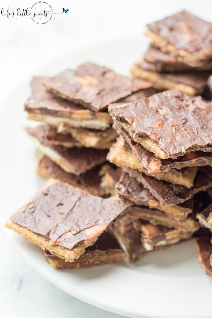 Chocolate Butterscotch Saltine Toffee combines semi sweet chocolate and butterscotch morsels with a classic, easy candy recipe: saltine toffee. Enjoy this butter-y, crisp and sweetly-addictive version of saltine toffee! #saltines #toffee #saltinetoffee #butterscotch #candy #recipe #homemade