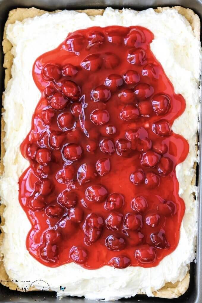 Looking for something quick to throw together for a get-together or just a special treat for the family? Look no further than this Easy Cherry Cheesecake! It's not too sweet with a creamier texture than traditional cheesecake. And if cherries aren't your thing, you can easily swap out the topping! #cake #dessert #sweet #cherries #cherry #cheesecake