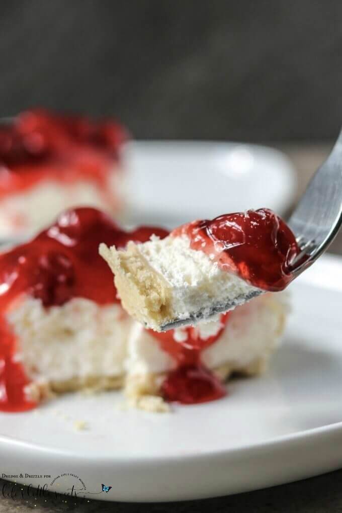 Looking for something quick to throw together for a get-together or just a special treat for the family? Look no further than this Easy Cherry Cheesecake! It's not too sweet with a creamier texture than traditional cheesecake. And if cherries aren't your thing, you can easily swap out the topping! #cake #dessert #sweet #cherries #cherry #cheesecake