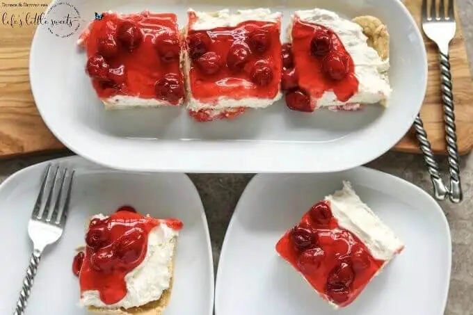 Looking for something quick to throw together for a get-together or just a special treat for the family? Look no further than this Easy Cherry Cheesecake! It's not too sweet with a creamier texture than traditional cheesecake. And if cherries aren't your thing, you can easily swap out the topping! #cake #dessert #sweet #cherries #cherry #cheesecake