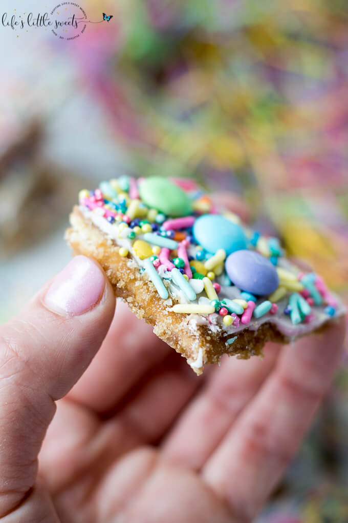Try this Easter Saltine Toffee recipe this Spring! This classic, Saltine Toffee is an simple to make recipe, using simple pantry ingredients, white chocolate, Easter-themed, pastel sprinkles and your favorite candies. #Easter #sprinkles #candy #Saltines #whitechocolate #chocolate #candy #homemade #easy #brownsugar