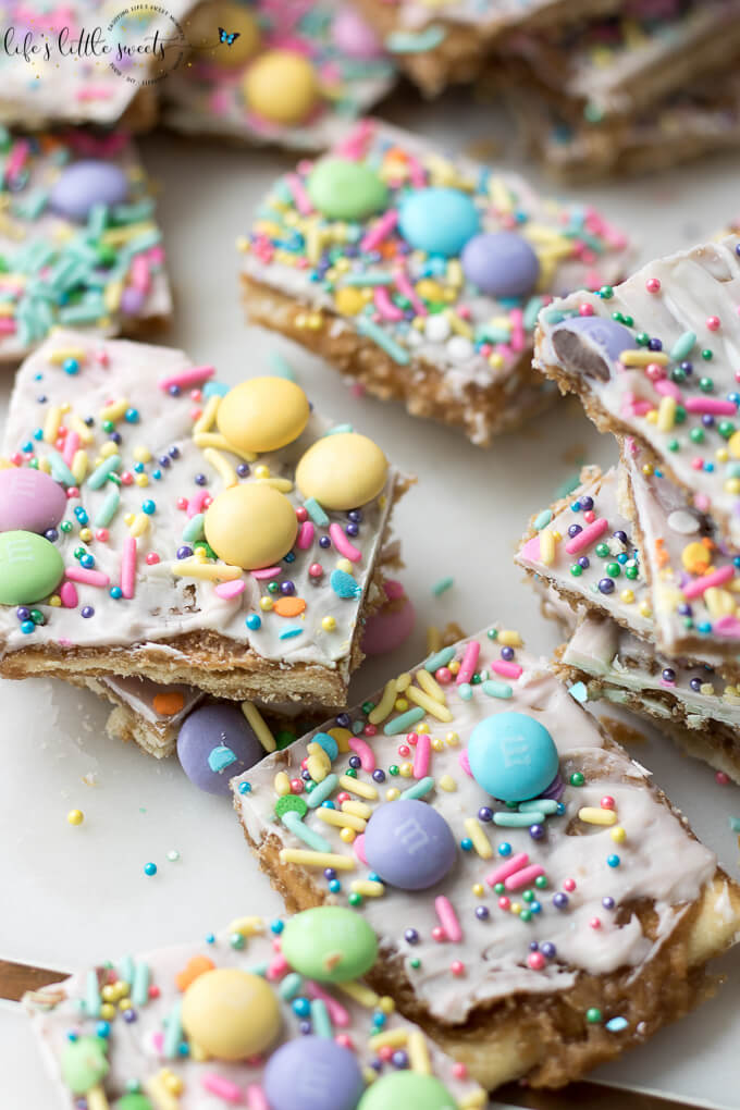 Try this Easter Saltine Toffee recipe this Spring! This classic, Saltine Toffee is an simple to make recipe, using simple pantry ingredients, white chocolate, Easter-themed, pastel sprinkles and your favorite candies. #Easter #sprinkles #candy #Saltines #whitechocolate #chocolate #candy #homemade #easy #brownsugar
