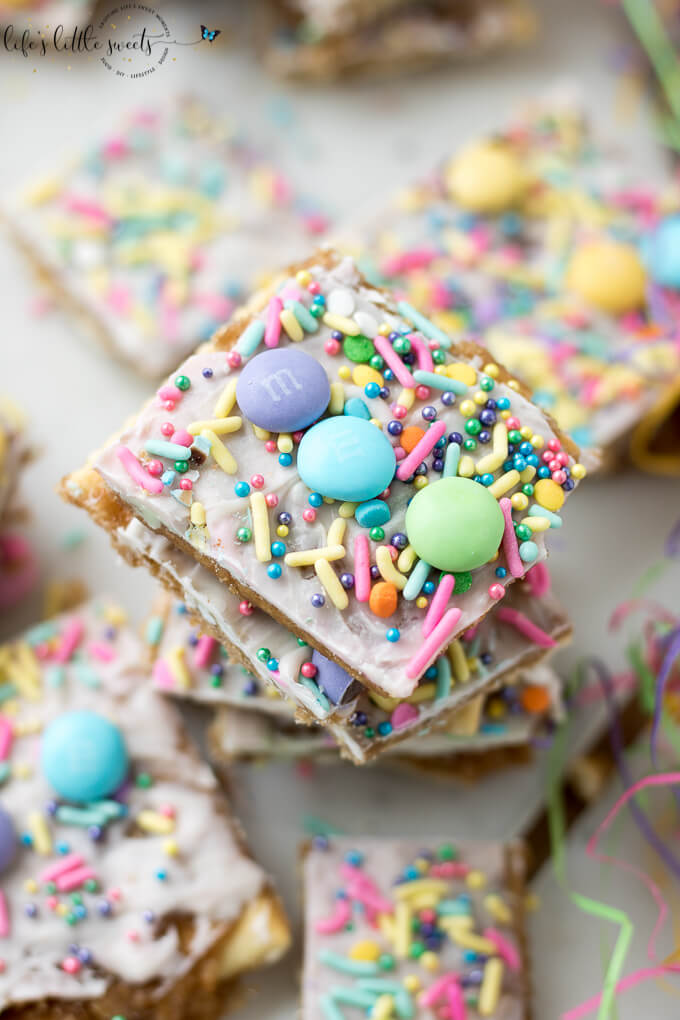 Try this Easter Saltine Toffee recipe this Spring! This classic, Saltine Toffee is an simple to make recipe, using simple pantry ingredients, white chocolate, Easter-themed, pastel sprinkles and your favorite candies. #Easter #sprinkles #candy #Saltines #whitechocolate #chocolate #candy #homemade #easy #brownsugar