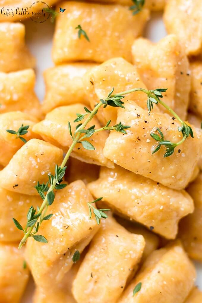 This Sweet Potato Gnocchi is surprisingly easy to put together. There are only 3-4 required ingredients and you can add some fresh herbs, like thyme or parsley for serving. Try this simple, homemade dish for your next meal! (dairy-free, vegetarian) #sweetpotatognocchi #gnocchi #sweetpotatoes #sweetpotato #Italianfood #recipe #homemade #thyme #egg #flour