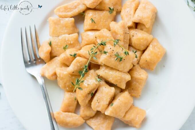 This Sweet Potato Gnocchi is surprisingly easy to put together. There are only 3-4 required ingredients and you can add some fresh herbs, like thyme or parsley for serving. Try this simple, homemade dish for your next meal! (dairy-free, vegetarian) #sweetpotatognocchi #gnocchi #sweetpotatoes #sweetpotato #Italianfood #recipe #homemade #thyme #egg #flour