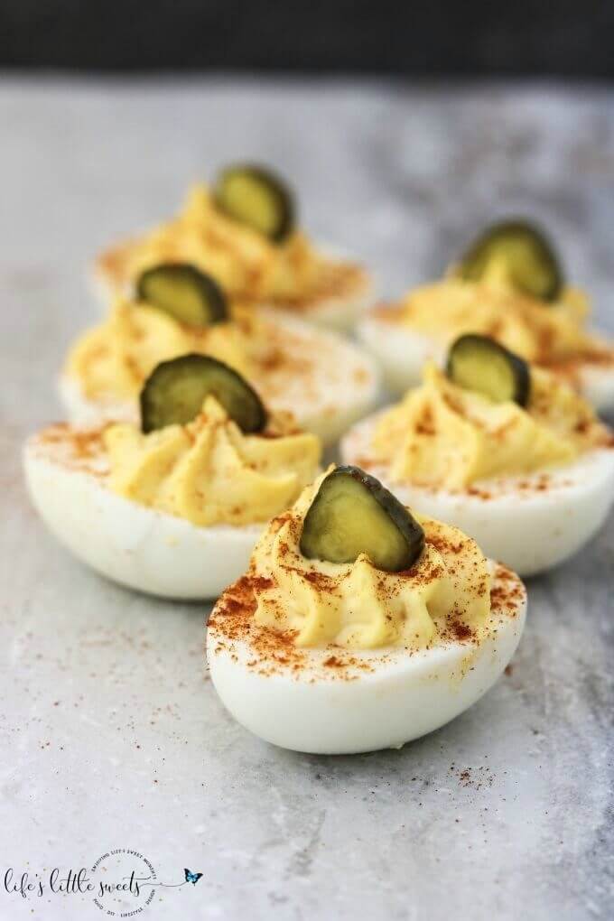 What's a holiday meal or cookout without Deviled Eggs? This classic recipe is creamy and garlicky and made with just six ingredients. #eggs #recipe #homemade #paprika #BBQ #egg #deviledeggs #appetizer