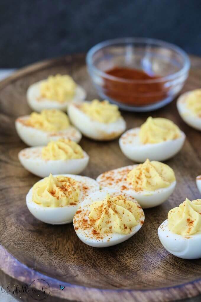 What's a holiday meal or cookout without Deviled Eggs? This classic recipe is creamy and garlicky and made with just six ingredients. #eggs #recipe #homemade #paprika #BBQ #egg #deviledeggs #appetizer