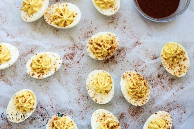 What's a holiday meal or cookout without Deviled Eggs? This classic recipe is creamy and garlicky and made with just six ingredients. #eggs #recipe #homemade #paprika #BBQ #egg #deviledeggs #appetizer