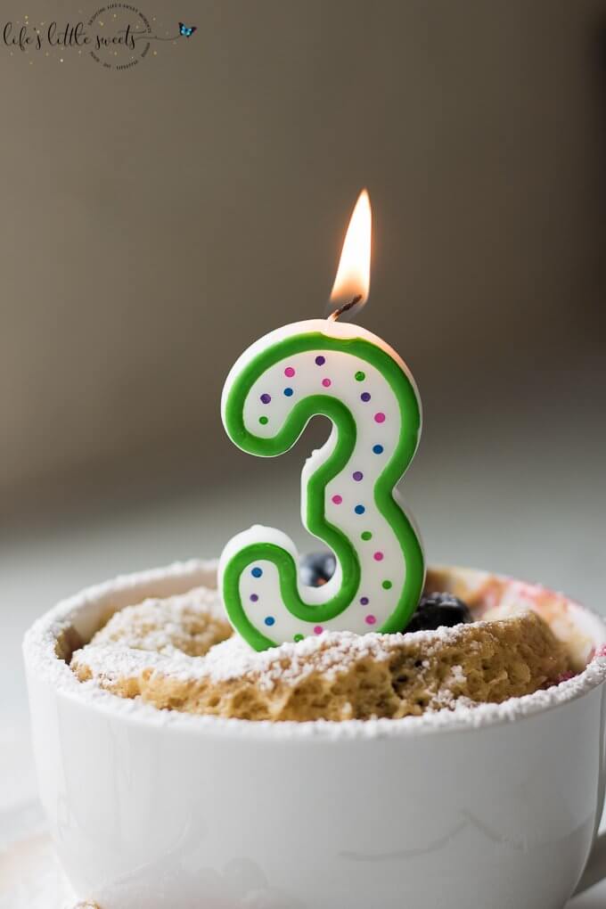 Easy Breakfast Mug Cake with a 3 candle lit on top