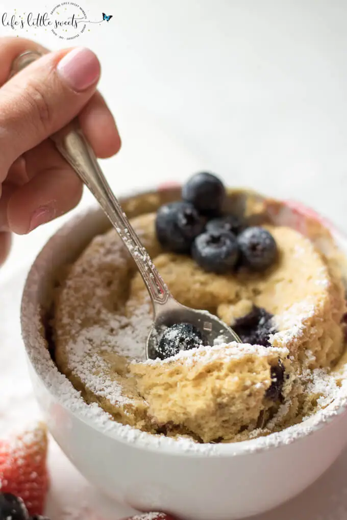 Spooning a bite of Easy Breakfast Mug Cake