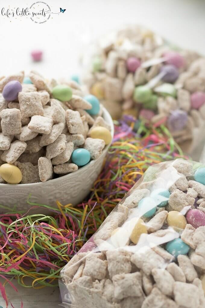 This Easter Muddy Buddies Recipe are a sweet and salty dessert snack with cereal coated in white chocolate and peanut butter, customized with your favorite Easter-themed candies. Try this delicious snack at your next Easter or Springtime gathering! #Spring #recipe #chocolate #M&Ms #peanutm&ms #snack #candy #muddybuddies #puppychow #Chex #ricecereal #Easter