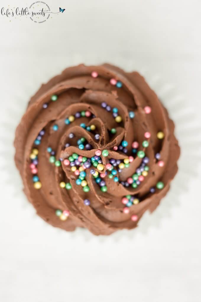 This Chocolate Buttercream Frosted Chocolate Cupcakes recipe is a classic, moist, chocolate cupcake recipe. They are topped with deliciously decadent chocolate buttercream frosting and your favorite sprinkles. (makes 24 cupcakes) #chocolate #buttercream #cupcakes #frosted #recipe #homemade #sprinkles #icing #buttermilk 