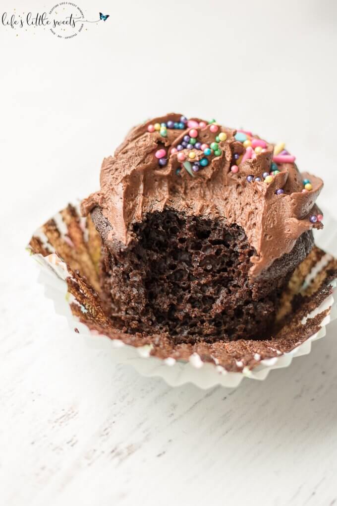This Chocolate Buttercream Frosted Chocolate Cupcakes recipe is a classic, moist, chocolate cupcake recipe. They are topped with deliciously decadent chocolate buttercream frosting and your favorite sprinkles. (makes 24 cupcakes) #chocolate #buttercream #cupcakes #frosted #recipe #homemade #sprinkles #icing #buttermilk 
