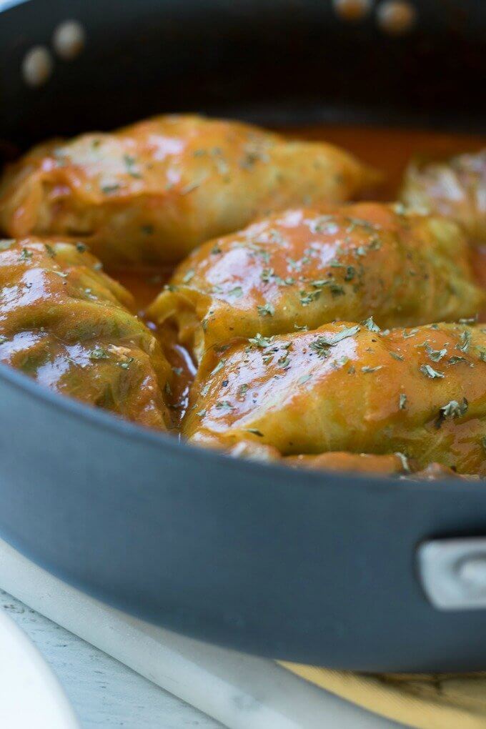 Stuffed Cabbage Rolls on SoFabFood - Filled with either lean ground turkey or beef, these Stuffed Cabbage Rolls are served with a tomato sauce and are sure to impress a dinner crowd. This simple weeknight meal is popular in Eastern Europe, the Mediterranean, and parts of Asia. This classic comfort food is a hit every time! #cabbagerolls #cabbage #turkey #recipe #homemade #tomatosoup #recipe