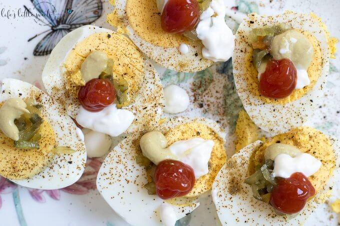 Lazy Person Deviled Eggs - haven't we (deviled egg lovers) done this at one point in our lives? Hard boiled eggs and all the favorite toppings, like mustard, mayonnaise, relish, cumin, paprika, salt and pepper - go! Just do it already! #deviledeggs #eggs #hardboiledeggs #appetizer #easy 