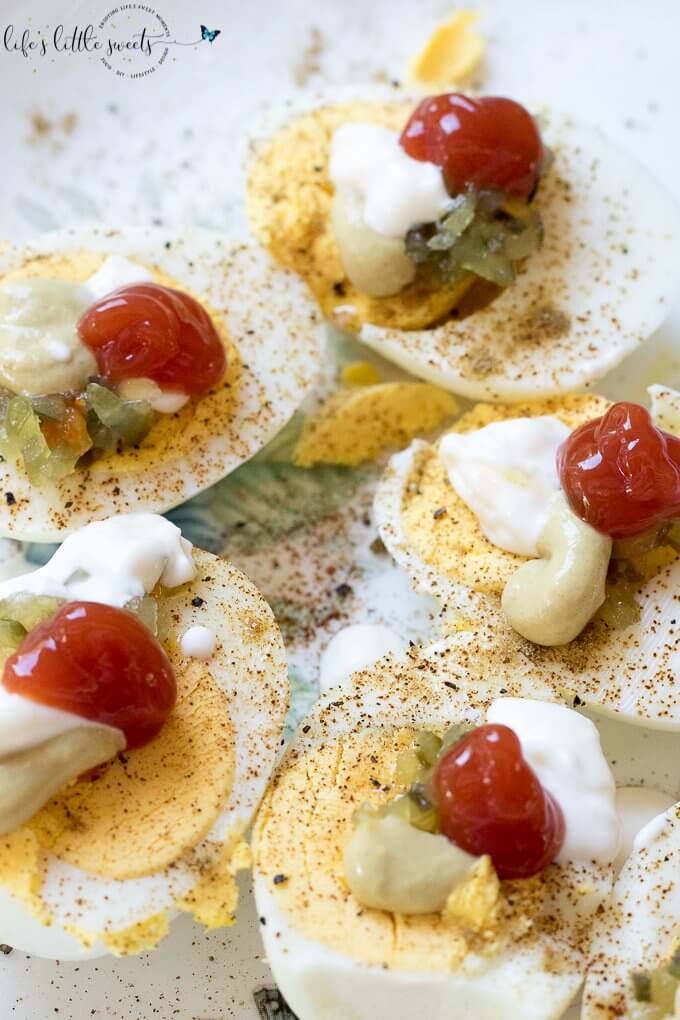Lazy Person Deviled Eggs - haven't we (deviled egg lovers) done this at one point in our lives? Hard boiled eggs and all the favorite toppings, like mustard, mayonnaise, relish, cumin, paprika, salt and pepper - go! Just do it already! #deviledeggs #eggs #hardboiledeggs #appetizer #easy 