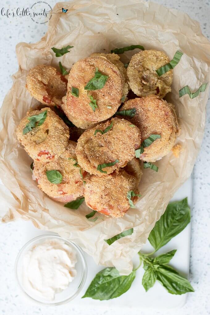 Gluten Free Fried Tomatoes are a delicious Summer appetizer or vegetarian side dish - juicy, ripe, red tomatoes with a gluten free flour, egg, milk and corn flour coating fried in Canola oil make for a crispy outer texture, sprinkle with fresh basil! #tomatoes #cornmeal #glutenfree #fried #canolaoil #appetizer #tomatoseason #friedtomatoes #basil