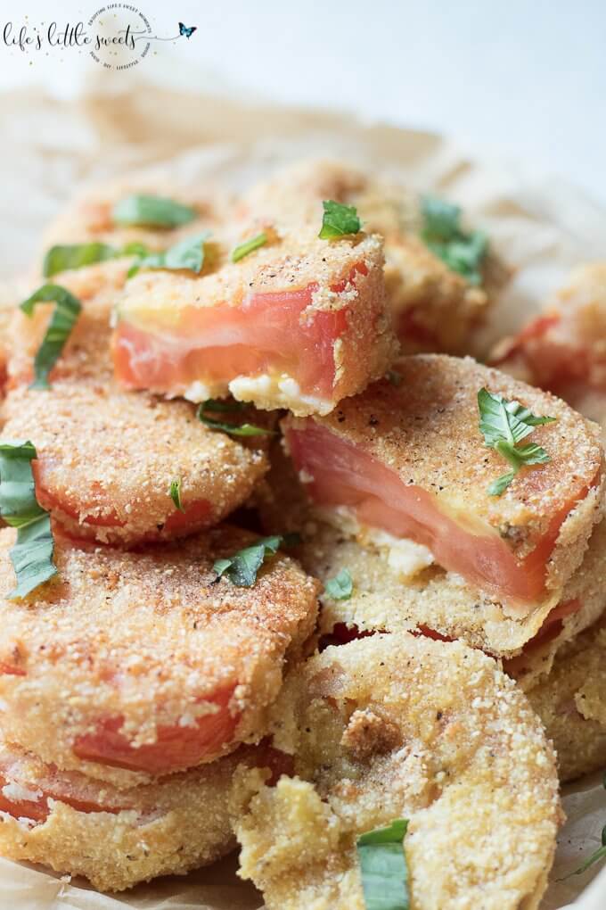 Gluten Free Fried Tomatoes are a delicious Summer appetizer or vegetarian side dish - juicy, ripe, red tomatoes with a gluten free flour, egg, milk and corn flour coating fried in Canola oil make for a crispy outer texture, sprinkle with fresh basil! #tomatoes #cornmeal #glutenfree #fried #canolaoil #appetizer #tomatoseason #friedtomatoes #basil