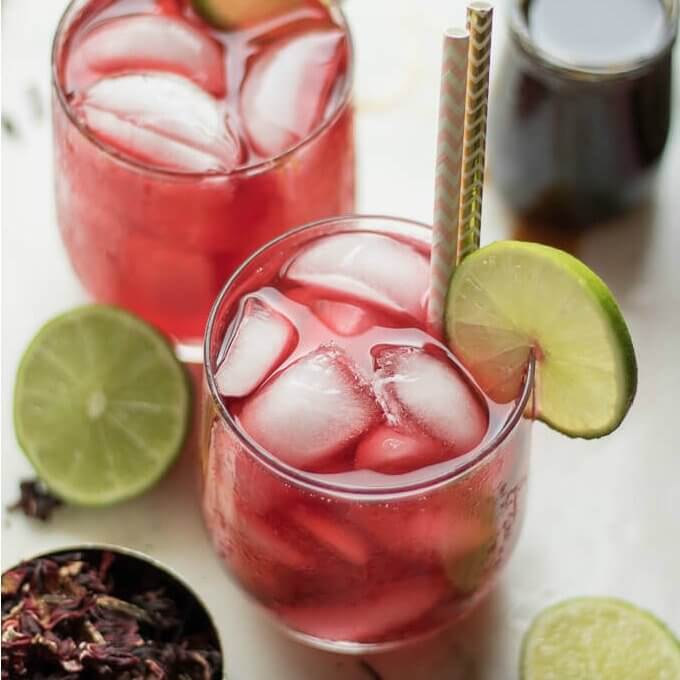 This Hibiscus Tea recipe uses dried hibiscus flowers and can be served unsweetened or sweetened with honey or your favorite sweetener and garnished with lime slices. 
