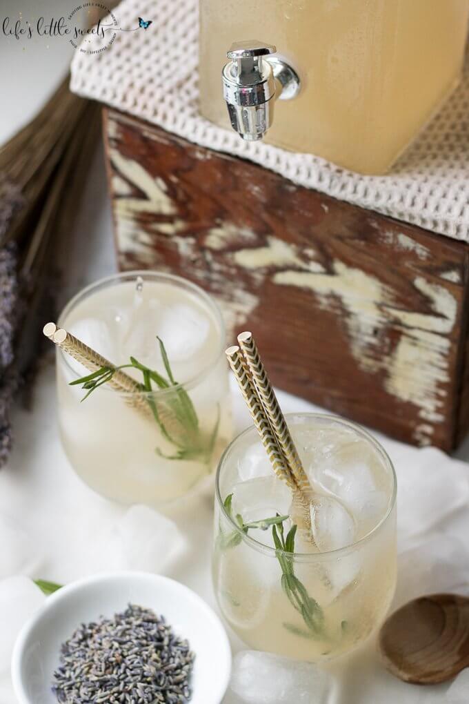 This Lavender Lemonade is made with freshly squeezed lemon juice then sweetened with a lavender-infused simple syrup. Garnish with food grade dried lavender flowers and a sprig of fresh lavender and you have yourself the ideal summer sipper! This recipe uses Lavender Simple Syrup. #lavender #lavenderlemonade #lemonade #driedlavender #iced #drink #colddrink #Summerdrink #vegan #glutenfree