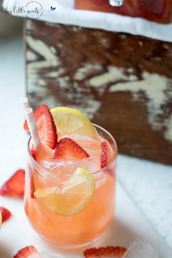 Strawberry Lemonade is the perfect iced beverage for Strawberry season! Give your classic lemonade a twist with this delicious and thirst quenching drink! #lemons #strawberry #strawberries #drink #iced #lemonade