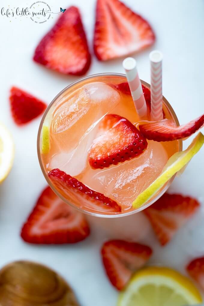 Strawberry Lemonade is the perfect iced beverage for Strawberry season! Give your classic lemonade a twist with this delicious and thirst quenching drink! #lemons #strawberry #strawberries #drink #iced #lemonade