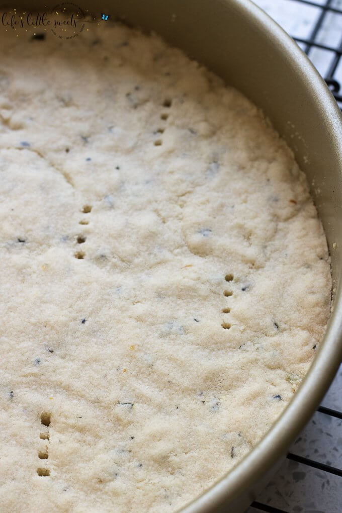 This Lavender Shortbread has fresh lavender, mint and lemon zest. Top with chopped nuts, like pecans, and dip in melted semi sweet chocolate, if you like. Welcome Summer with all it's fresh ingredients in this classic shortbread recipe. #lavender #mint #shortbread #freshlavender #lemon #lemonzest #pecans #cookies #chocolate #chocolatedipped