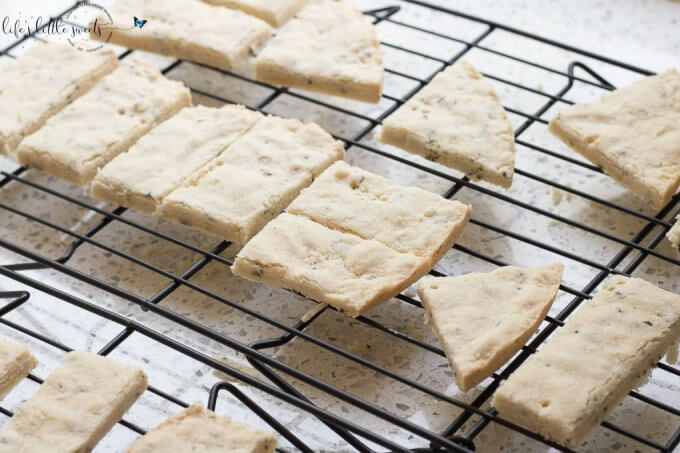 This Lavender Shortbread has fresh lavender, mint and lemon zest. Top with chopped nuts, like pecans, and dip in melted semi sweet chocolate, if you like. Welcome Summer with all it's fresh ingredients in this classic shortbread recipe. #lavender #mint #shortbread #freshlavender #lemon #lemonzest #pecans #cookies #chocolate #chocolatedipped