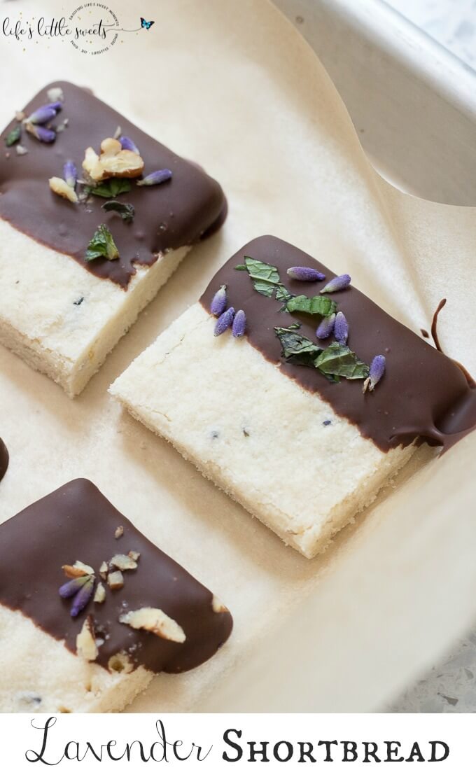 This Lavender Shortbread has fresh lavender, mint and lemon zest. Top with chopped nuts, like pecans, and dip in melted semi sweet chocolate, if you like. Welcome Summer with all it's fresh ingredients in this classic shortbread recipe. #lavender #mint #shortbread #freshlavender #lemon #lemonzest #pecans #cookies #chocolate #chocolatedipped