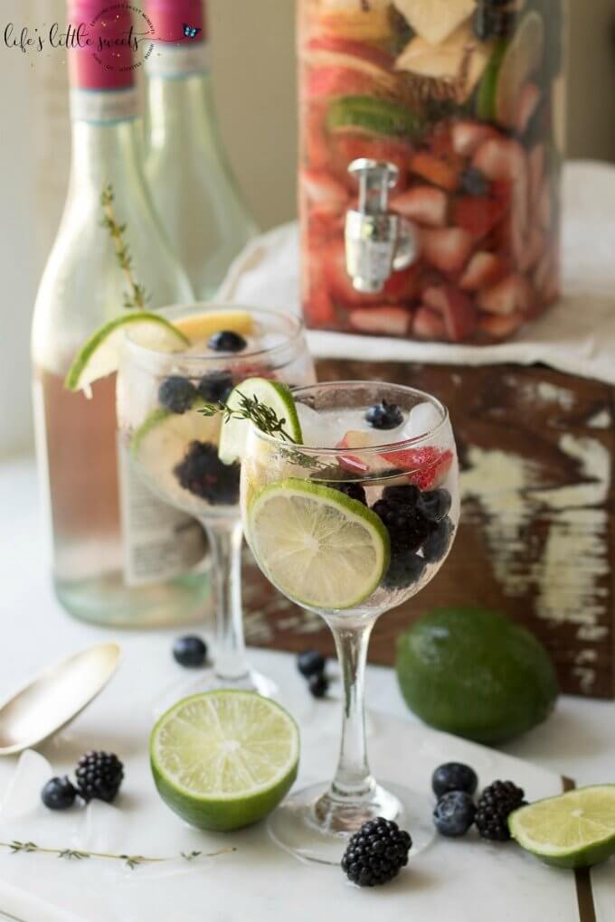 This Rosé Sangria recipe is a light and fruity summer cocktail that’s perfect for using those fresh farmers market finds. Serve this refreshing drink for Sunday brunch or outdoor entertaining and you’re sure to impress guests! #ad @sofabfood #rose #fruit #lime #strawberry #wine #berries #blueberries #thyme #Summer