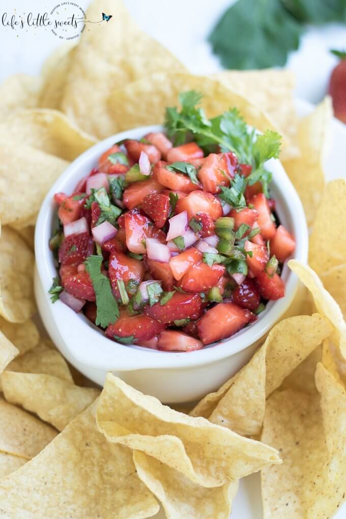 This Strawberry Salsa is naturally sweet, savory, refreshing and crisp. It has sweet ripe and fresh strawberries, a little heat from 1 jalapeño pepper, crisp red onion, with fresh cilantro and optional maple syrup. Enjoy this full-flavored, fruit salsa that has garden-fresh flavors in an incredibly simple recipe! #salsa #recipe #strawberry #maplesyrup #cilantro #redonion #appetizer #jalapeño #homemade #vegan #glutenfree