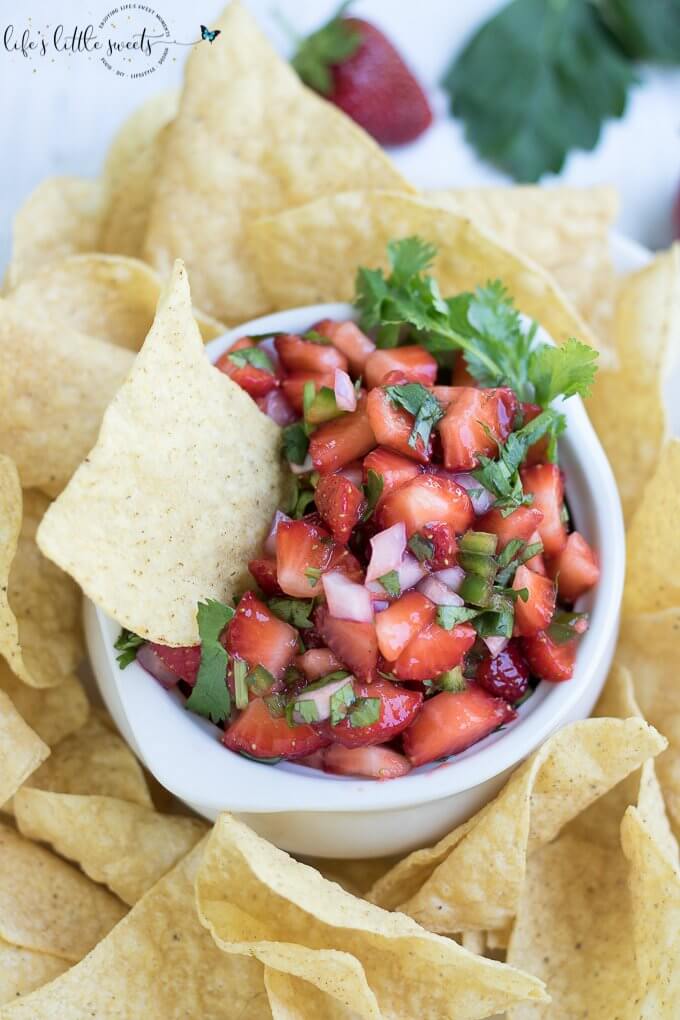 This Strawberry Salsa is naturally sweet, savory, refreshing and crisp. It has sweet ripe and fresh strawberries, a little heat from 1 jalapeño pepper, crisp red onion, with fresh cilantro and optional maple syrup. Enjoy this full-flavored, fruit salsa that has garden-fresh flavors in an incredibly simple recipe! #salsa #recipe #strawberry #maplesyrup #cilantro #redonion #appetizer #jalapeño #homemade #vegan #glutenfree