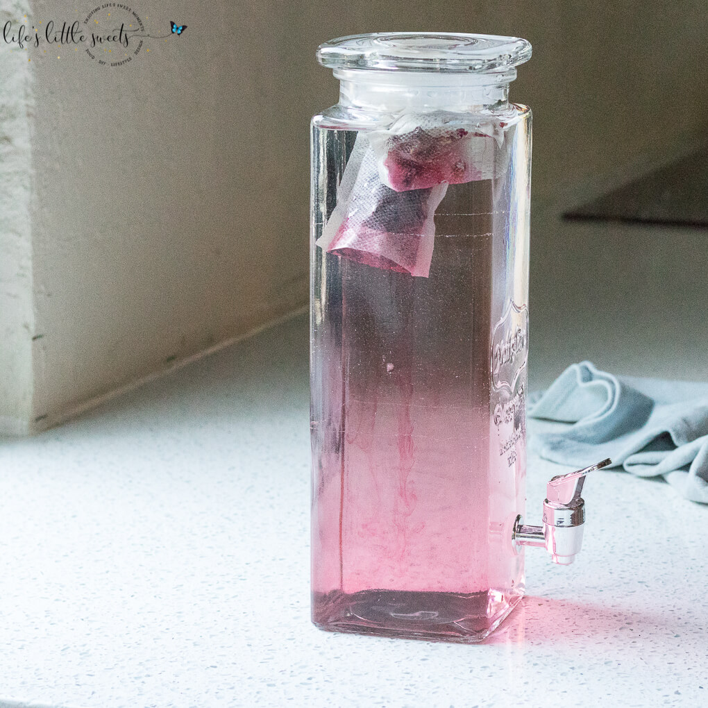 Cold Brew Hibiscus Tea on a counter in a glass container