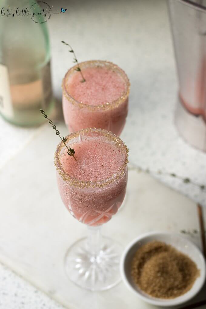 Frosé (Frozen Rosé Wine) - Treat yourself to this frozen Rosé wine recipe complete with fresh mint, fresh squeezed lemon juice, blended with crushed ice. #rose #wine #slush #mint #lemonjuice #ice #cocktail #sweet