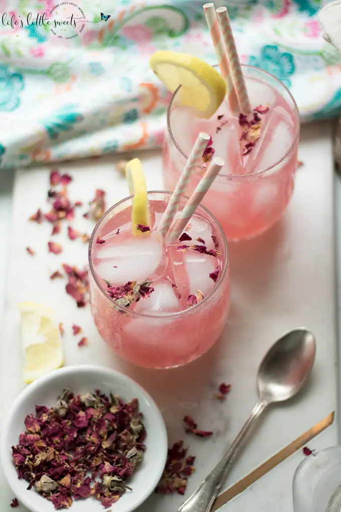 This Rosewater Lemonade is a thirst-quenching classic lemonade recipe with a fragrant and floral twist. Try this unique and beautiful lemonade for your next gathering! #rosewater #lemonade #drink #rose #roses #lemons #lemon #beverage #recipe #sweet