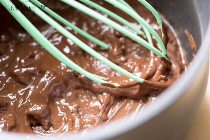 a whisk making Easy Dairy Free Ice Cream Pops