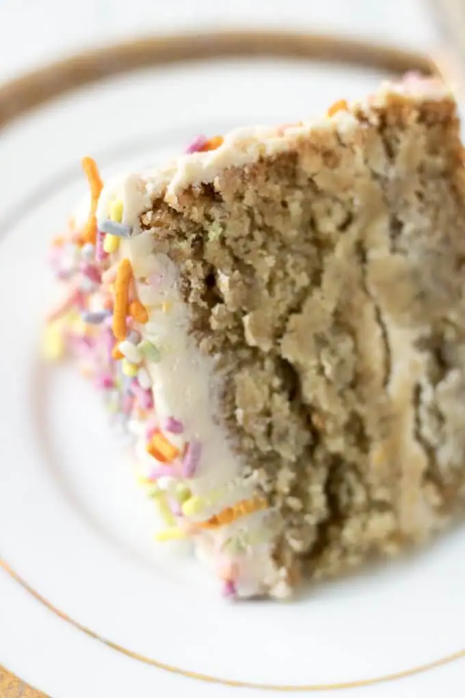 This 1st Birthday Cake recipe has 2 tiers, 5-inch diameter layers of delicious banana bread cake with a cream cheese frosting - all naturally-sweetened of course :) Top with all natural sprinkles for the cutest 1st Birthday cake ever! (gluten-free option) #cake #bananabread #1stbirthdaycake #naturallysweetened #maplesyrup #creamcheesefrosting #bananacake #birthdaycake #birthday #recipe