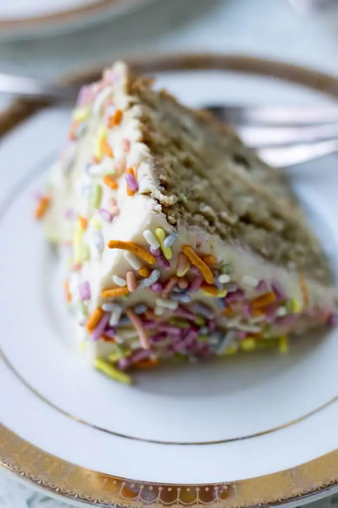 This 1st Birthday Cake recipe has 2 tiers, 5-inch diameter layers of delicious banana bread cake with a cream cheese frosting - all naturally-sweetened of course :) Top with all natural sprinkles for the cutest 1st Birthday cake ever! (gluten-free option) #cake #bananabread #1stbirthdaycake #naturallysweetened #maplesyrup #creamcheesefrosting #bananacake #birthdaycake #birthday #recipe