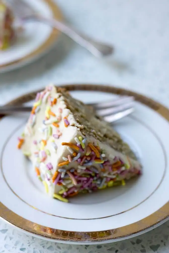 This 1st Birthday Cake recipe has 2 tiers, 5-inch diameter layers of delicious banana bread cake with a cream cheese frosting - all naturally-sweetened of course :) Top with all natural sprinkles for the cutest 1st Birthday cake ever! (gluten-free option) #cake #bananabread #1stbirthdaycake #naturallysweetened #maplesyrup #creamcheesefrosting #bananacake #birthdaycake #birthday #recipe